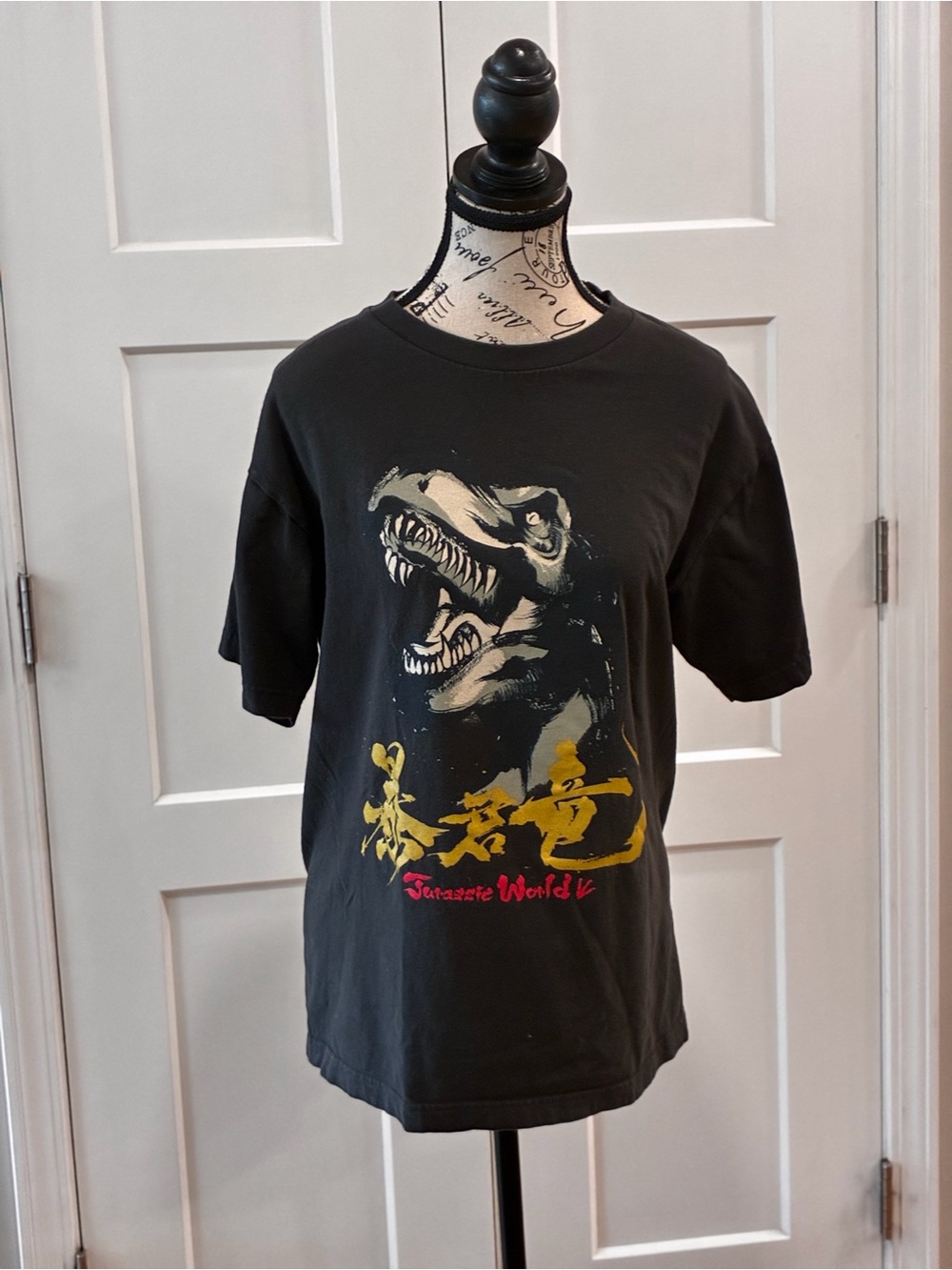 Universal Men’s Black Graphic Tee with Gold & Red Dinosaur Print